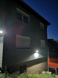 a building with two lights on the side of it at Pegasus Bergblick in Heidenheim an der Brenz