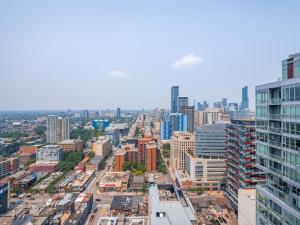 an aerial view of a city with tall buildings at Designer One Bedroom Suite - Entertainment District Toronto in Toronto