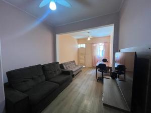 a living room with a couch and a table at LiveRio Hostel Ipanema in Rio de Janeiro