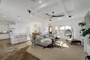 a living room and kitchen with a couch and a table at Spacious House in Roundrock in Round Rock