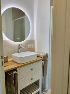 a bathroom with a sink and a mirror at Entre Loire et Château in Amboise +23 photos