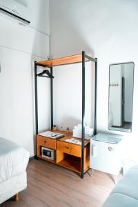 a room with a dressing table and a mirror at Hostel Sweet Home Palermo Soho in Buenos Aires