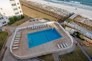 an overhead view of a swimming pool and the beach at Regency Towers W 707 in Pensacola Beach