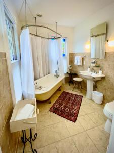 a bathroom with a tub and a sink at The Inn at Onancock in Onancock