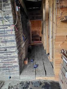 an inside of a building with a room with a bench at paradise of tusheti in Omalo