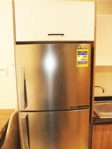 a stainless steel refrigerator in a kitchen at Aldau heights Mathew in Hurghada