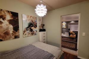 a bedroom with a bed and a large painting on the wall at Superb and central place! Airb&b favorite in Bergen