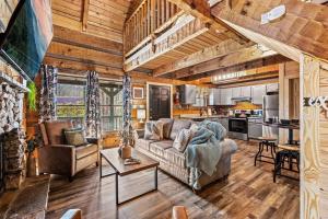 a living room with a couch and a table at The Willows in Sevierville