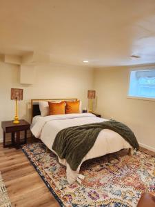 a bedroom with a large bed and a rug at Starlight Guesthouse in West Orange