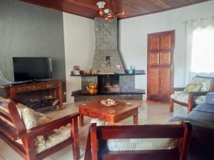 TV a/nebo společenská místnost v ubytování Casa de Campo Bela Vista