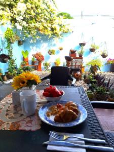 a table with a plate of food on top of it at Casa Río donde guardamos un secreto encantador in Montería