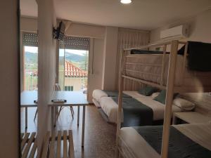 Postel nebo postele na pokoji v ubytování Hostal Garamar