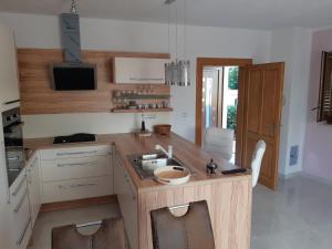 a kitchen with a sink and a counter at Ferienwohnung mit Terrasse für sechs Personen in Bale