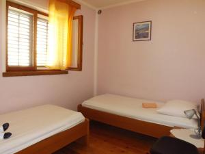 Postel nebo postele na pokoji v ubytování Apartment Prizba 4483c