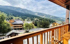 a view from a balcony of a ski resort at Résidence Croix De Verdon - 2 Pièces pour 6 Personnes 204 in Les Allues