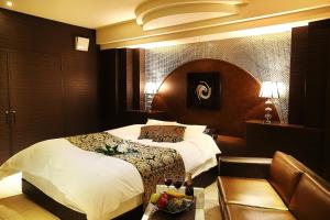 Tempat tidur dalam kamar di Hotel L'eclair (Adult Only)
