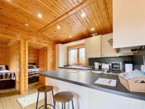 a kitchen with a counter and a bed in a room at Pine Lodge - Uk46279 in Camerton