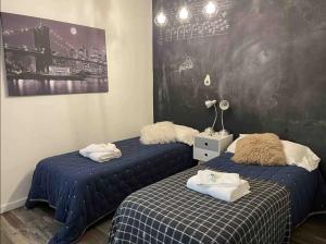 En eller flere senge i et værelse på Gran Casa Palermo HollyHouse