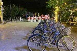 a row of blue bikes parked next to each other at The Pineapple House in Ninh Binh