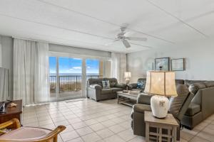 a living room with a view of the ocean at Oceanfront Condo w Balcony in Amelia Island