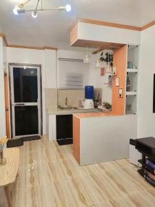 a kitchen with a sink and a counter top at Catalena Transient House Bayugan City in Bayugan City +2 photos