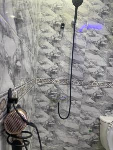 a shower with a hose in a bathroom at casa chaouen in Chefchaouen