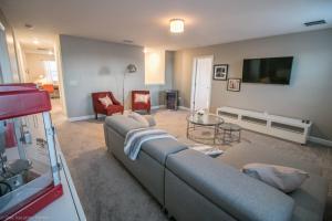 a living room with a couch and a table at 1581 PD - Exquisite 6BR Haven: Private Pool in Davenport