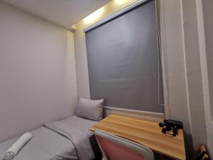 Postel nebo postele na pokoji v ubytování Autumn Guesthouse's near Jalan Alor Bukit Bintang