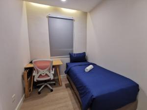 Postel nebo postele na pokoji v ubytování Autumn Guesthouse's near Jalan Alor Bukit Bintang