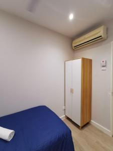 Postel nebo postele na pokoji v ubytování Autumn Guesthouse's near Jalan Alor Bukit Bintang