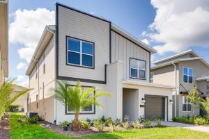 a home with a gray and white house at 2751 BD -Luxury 5BR Single Family - Private Pool in Kissimmee +28 photos