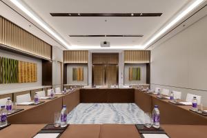 a conference room with tables and bottles of water at Novotel Xi'an Aden in Xi'an