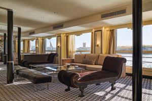 a living room with a couch and a table at Star Nile cruise in Luxor