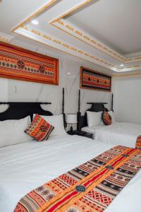 Postel nebo postele na pokoji v ubytování Trung Huyền Hotel