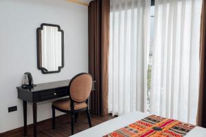Postel nebo postele na pokoji v ubytování Trung Huyền Hotel