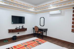TV a/nebo společenská místnost v ubytování Trung Huyền Hotel