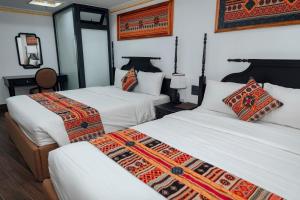 Postel nebo postele na pokoji v ubytování Trung Huyền Hotel