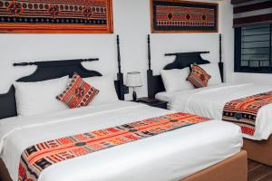 Postel nebo postele na pokoji v ubytování Trung Huyền Hotel