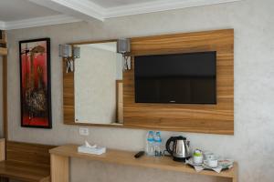 a flat screen tv on a wall in a room at Star Nile cruise in Luxor