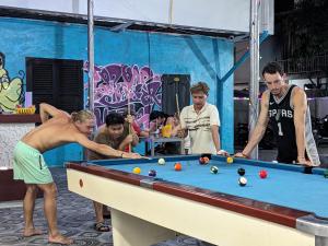 a group of men playing a game of pool at Vientiane Garden Hostel in Vientiane