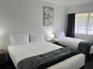 Krevet ili kreveti u jedinici u objektu Magnolia Court Motel