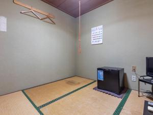 TV a/nebo společenská místnost v ubytování Kawabata Ryokan Takehara by Tabist