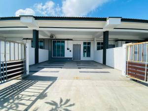 a large white house with a walkway at Alyn Home Kluang IV Netflix Wifi Coway in Kluang