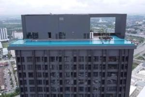 a building with a swimming pool on top of it at Sky Pool 4 Star grade stay in i-City in Shah Alam +4 photos