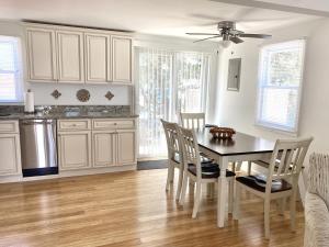 a kitchen with a dining room table and chairs at Lbi Vacation Rental Property in Beach Haven