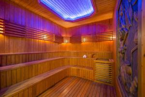 a large wooden sauna with a skylight at V-Hotel in Da Nang
