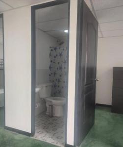 an open door to a bathroom with a toilet at Apartamentos - Brisas del Mirador - Panamá Campestre 