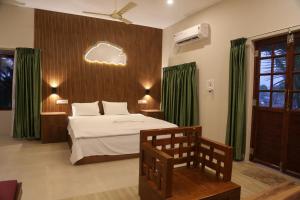 Ένα ή περισσότερα κρεβάτια σε δωμάτιο στο Kandal Theeram Farms +50 φωτογραφίες