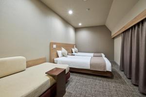 Postel nebo postele na pokoji v ubytování Hotel Villa Fontaine Tokyo-Jimbocho
