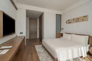 TV a/nebo společenská místnost v ubytování Sahe Hotel Shanghai World Expo